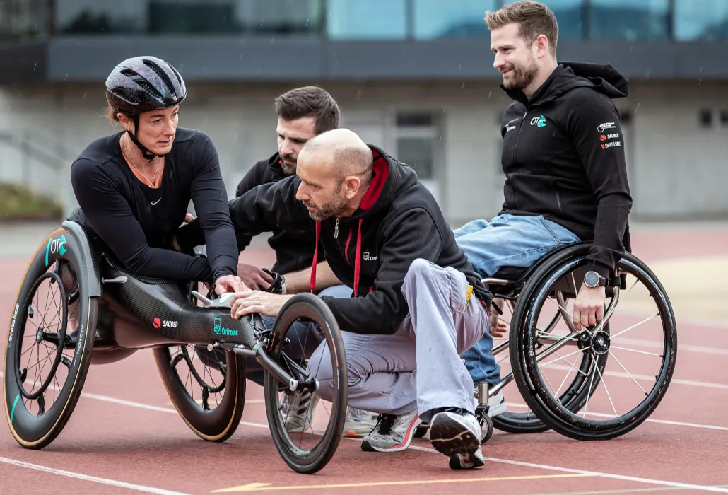 US athlete Tatyana McFadden perfecting her position in her new racing wheelchair with the help of the Orthotec team. 