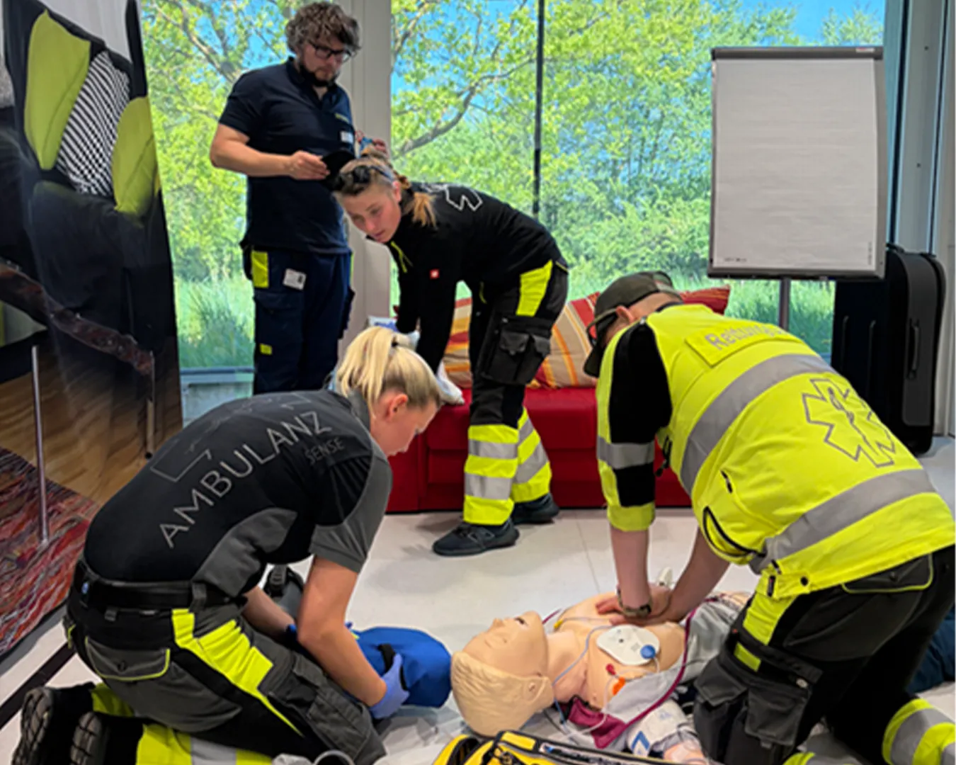 SIRMED performing CPR on a person on the ground.