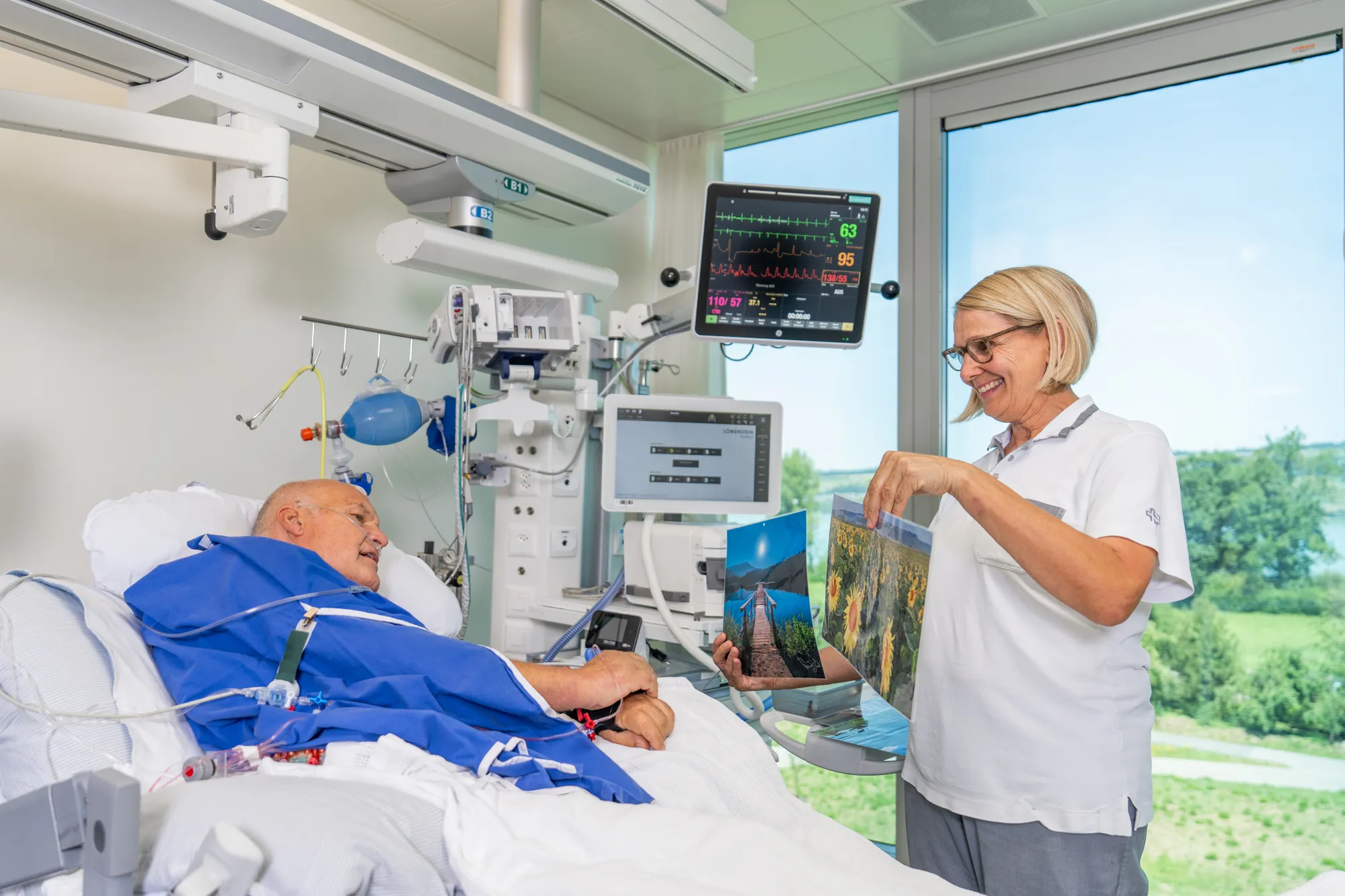 A medical team attending to a patient in a hospital room.